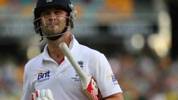 Burnt out: Jonathan Trott walks off from the Gabba.