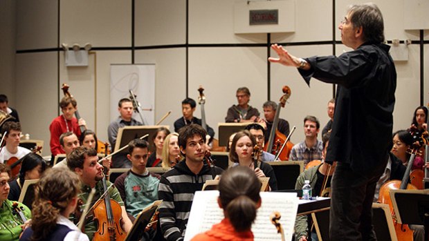 Conductor Michael Tilson Thomas directs the YouTube Symphony Orchestra ahead of a concert at Carnegie Hall.