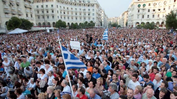 Protestors listen to famous Greek composer Mikis Theodorakis giving a speech at the Aristotelous square in Thessaloniki.