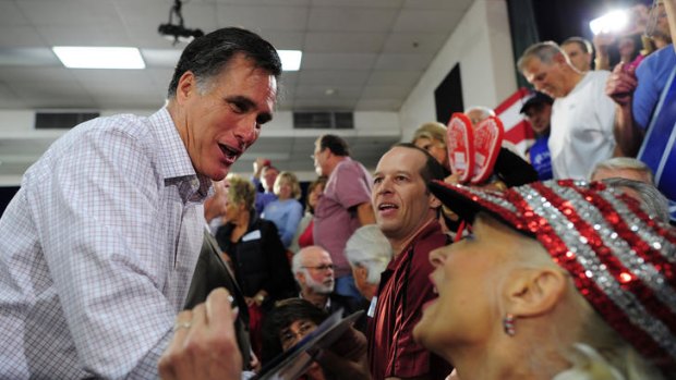Shake hands with Mr Fixit: Mitt Romney greets the crowd at the Emma Lou Olson Civic Centre ahead of this week's Florida primary.