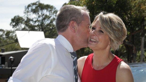 Opposition Leader Bill Shorten greets Kristina Keneally as they meet with voters at the Ryde East Public School polling booth during the Bennelong by-election.