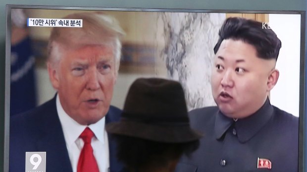 A man watches a television screen showing U.S. President Donald Trump, left, and North Korean leader Kim Jong-un during a news program at the Seoul Train Station in Seoul, South Korea.