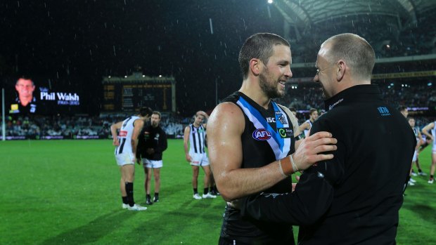 ADELAIDE, AUSTRALIA - JULY 9: Travis Boak and Ken Hinkley of the Power celebrate during the 2015 AFL round 15 match between Port Adelaide Power and the Collingwood Magpies at the Adelaide Oval on July 9, 2015 in Adelaide, Australia. (Photo by James Elsby/AFL Media/Getty Images)