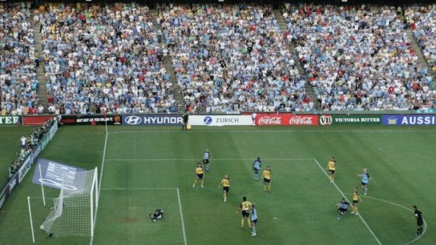 Sky high: Steve Corica fires home the winning goal for Sydney FC in the first A-League grand final.