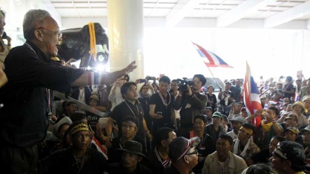 Inside: Suthep Thaugsuban speaks to his supporters inside Thailand's Finance Ministry in central Bangkok on Monday.