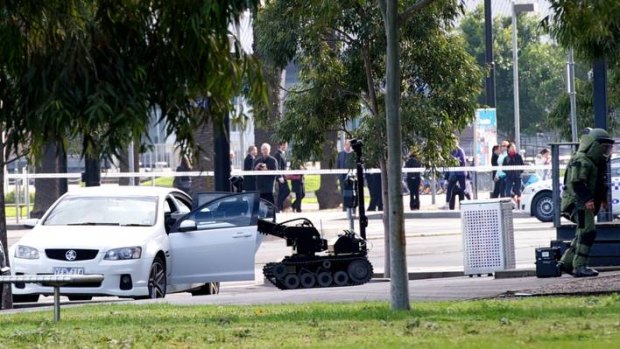 A bomb squad robot combs the Commodore on Harbour Esplande, Docklands, yesterday.
