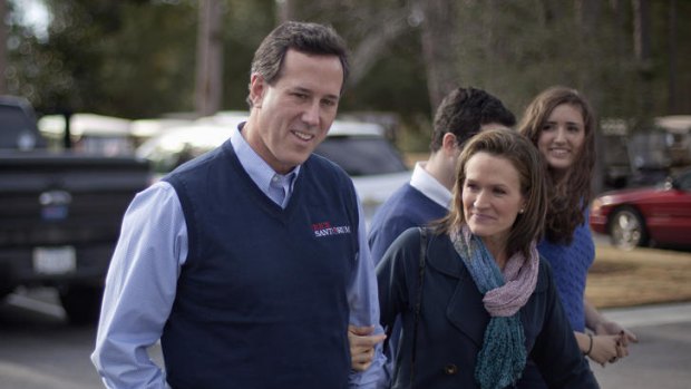 Republican presidential candidate Rick Santorum with his wife Karen, son Daniel, 16, and daughter Sarah, 14, in Sun City, South Carolina on Thursday.