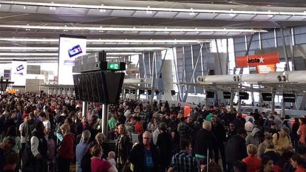 Large crowds at Sydney airport after a power outage at T2 terminal. 