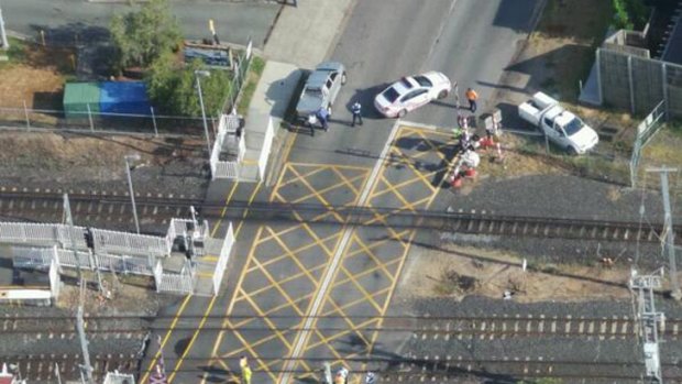 Police at the Barrack Road level crossing in Cannon Hill. Photo: Penny Dahl, Australian Traffic Network.