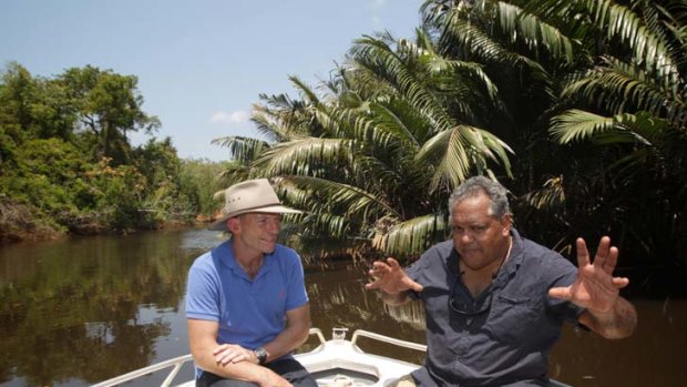 Two men and a boat ... Noel Pearson and Tony Abbott were alone on a river in Cape York yesterday.