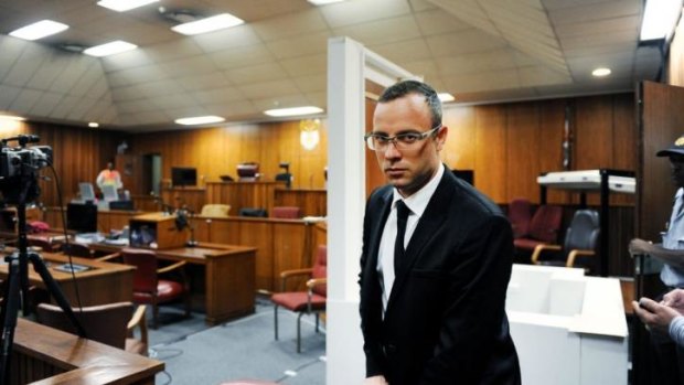 Unlikely to testify first: Paralympian Oscar Pistorius is seen in the courtroom after his murder trial was postponed at the high court in Pretoria on March 28.