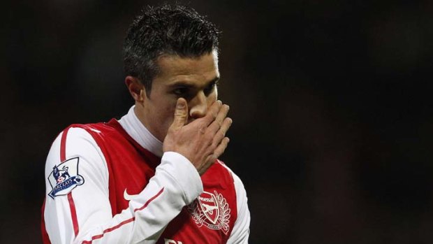 Arsenal's Robin Van Persie reacts during their English Premier League soccer match against Bolton Wanderers at the Reebok Stadium in Bolton, northern England.