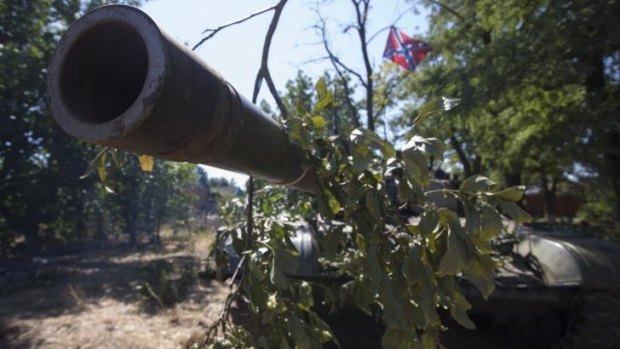 A barrel of a T-72 tank with a flag of the Donetsk People's Republic in the southern coastal town of Novoazovsk.