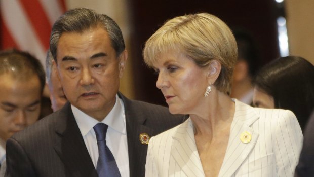 Foreign Affairs Minister Julie Bishop with Chinese Foreign Minister Wang Yi at an ASEAN meeting in July.