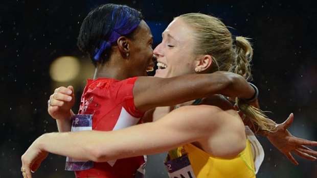 Respect ... Australia's Sally Pearson is congratulated by Kellie Wells.