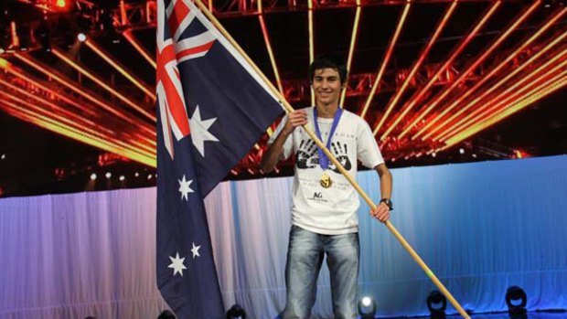 World Cyber Games gold medal winner Charlie Elliott proudly waves the flag.