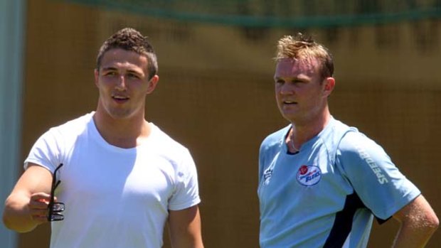 Bystanders ... NRL star Sam Burgess, left, with recovering NSW paceman Doug Bollinger, who will turn out for his club this weekend in a bid to gain Ashes selection.