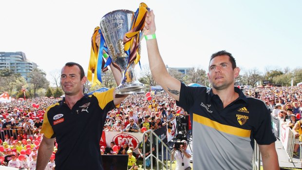 Shannon Hurn of the Eagles (left) and Luke Hodge of the Hawks with the cup.