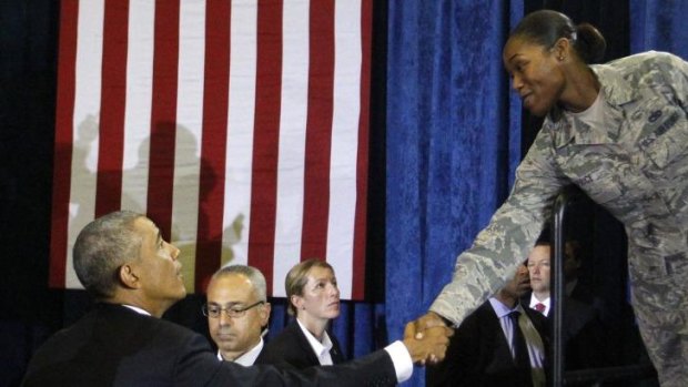 President Barack Obama thanks a military member after his speech.