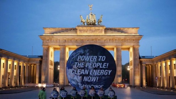 Members of Greenpeace at the Brandenburg Gate in Berlin.