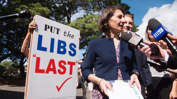 NSW Premier Gladys Berejiklian visits Manly West Primary School on Saturday with Liberal candidate James Griffin, where he cast his vote.