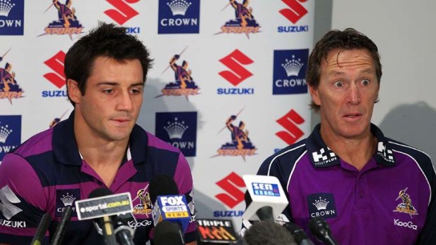 Eye popper &#8230; Cooper Cronk with Craig Bellamy yesterday after the star No.7 announced he was remaining with the Storm.