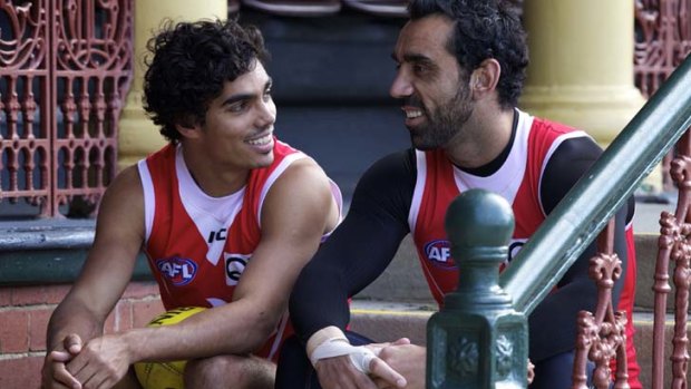 All smiles &#8230; Tony Armstrong chats with boyhood hero and teammate Adam Goodes. Armstrong was raised in Sydney, supported the Swans and even went to a clinic as a youngster to meet his idols.