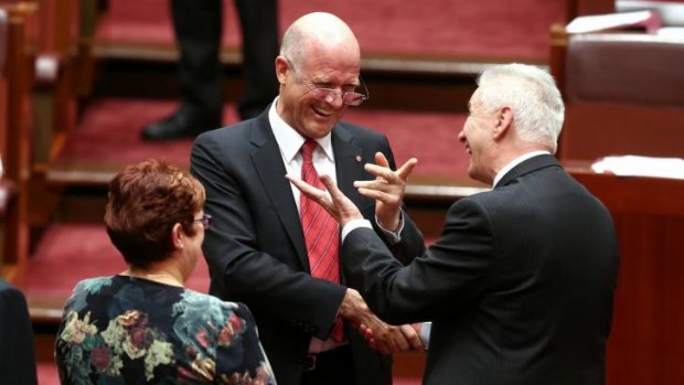 Senator David Leyonhjelm is congratulated by Senator Doug Cameron after delivering his first speech in the Senate last week.