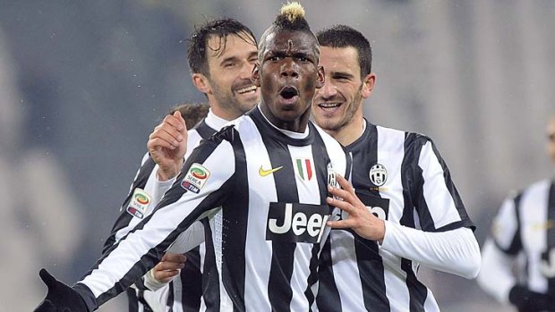 Paul Pogba celebrates with teammates Leonardo Bonucci (right) and Mirko Vucinic after scoring against Udinese.