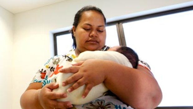 Faleata Tuifua nurses her newborn son, Tui. Delivery rooms and operating theatres are now on the same floor. In the old hospital, women in labour who needed surgery were taken to another floor in lifts shared by the public.