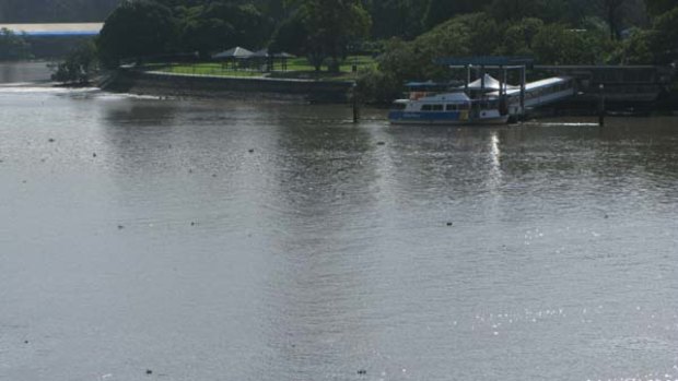 Debris is scattered across the Brisbane River.