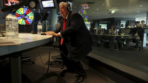 Ready to spruik: Clive Palmer does his 'twerk' dance moves for Kyle and Jackie O during a radio interview in Sydney.