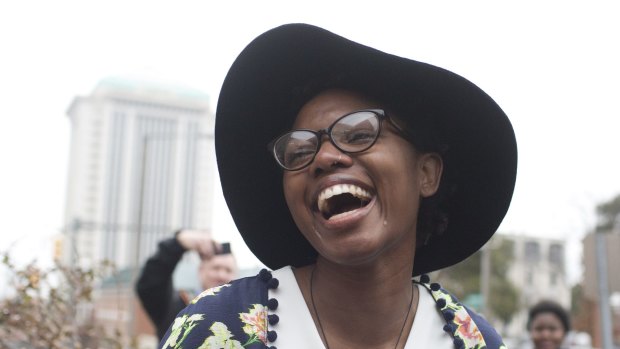 Tori Sisson laughs with happiness during her wedding to Shante Wolfe. The women were the first same-sex couple to file their marriage licence in Montgomery, Alabama. 