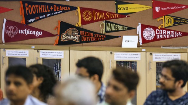 US universities banners are displayed at a session by the University of Southern California Education Foundation in Mumbai, last month. Indian students in the US are often snapped by companies like Google and Microsoft. 