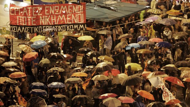 Protesters hold a rally outside parliament in Athens, Greece.