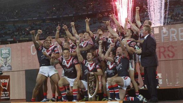 Out of nowhere: Ecstatic Roosters players and coach celebrate a hard-fought win over the Sea Eagles.