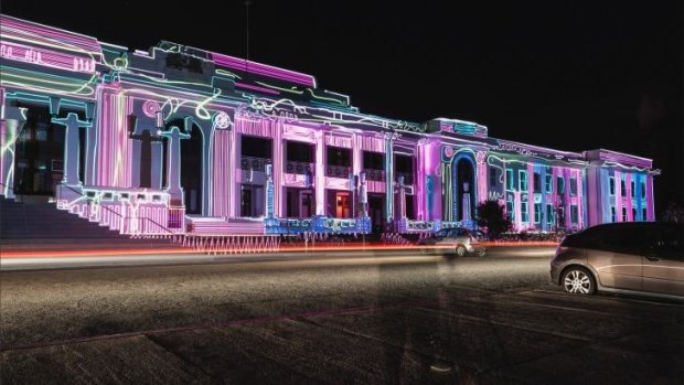 Lit up: A ghostly figure views Enlighten 2014 at Old Parliament House.