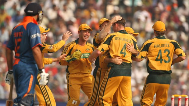 Doug Bollinger is surrounded by delighted Australian teammates after dismissing Indian dangerman Sachin Tendulkar.