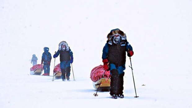 The team of explorers on the approach in white-out conditions.
