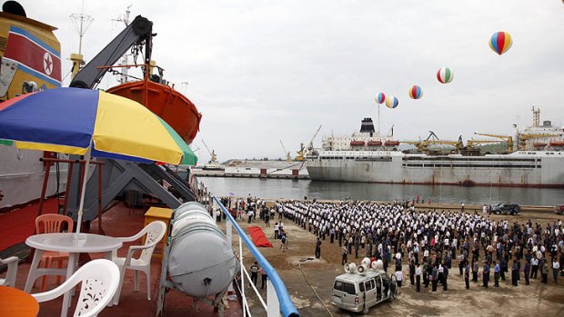 A crowd of North Koreans gather to see off the Man Gyong Bong on its maiden voyage.