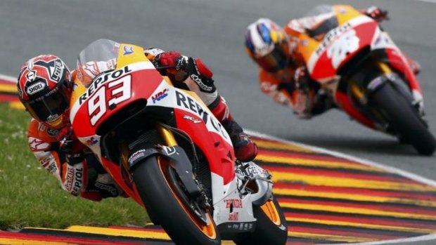 Honda MotoGP riders Marc Marquez of Spain and compatriot Dani Pedrosa of Spain (R) lead the German Grand Prix.