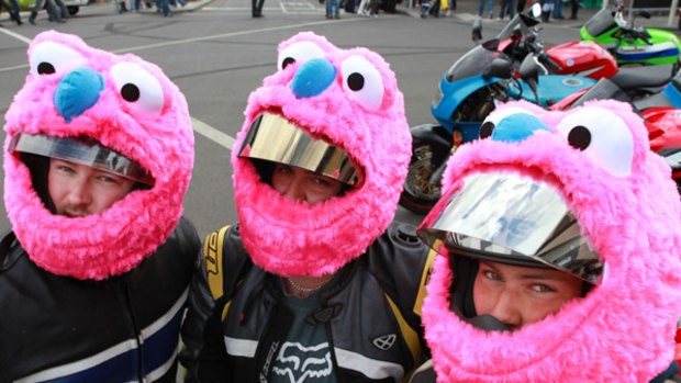 Steve Mion, Michael Chybowski and Kristian Palumbo with their customised pink helmets.