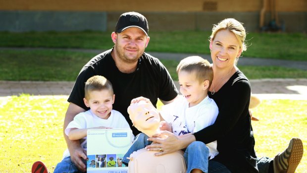 Shaun and Belinda Hedley with their twin sons Seth and Braith and a CPR kit in 2009.