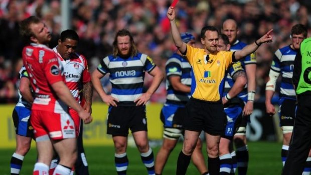 Sila Puafisi of Gloucester receives a red card from referee Tim Wigglesworth.