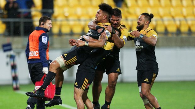 Potent threat: Ardie Savea is congratulated on his match-winning try by Jamison Gibson-Park, Chris Eves and Matt Proctor during the round 14 match between the Hurricanes and the Highlanders.