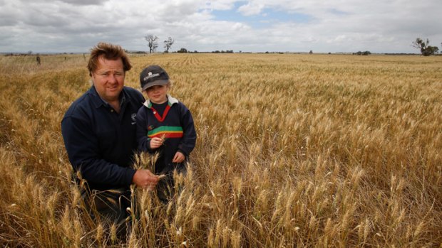 Supportive: Grain grower Chris Sharkey, with son Jack at their farm in Balliang East, says the Treasurer adopted a common-sense approach in rejecting the takeover bid on GrainCorp.