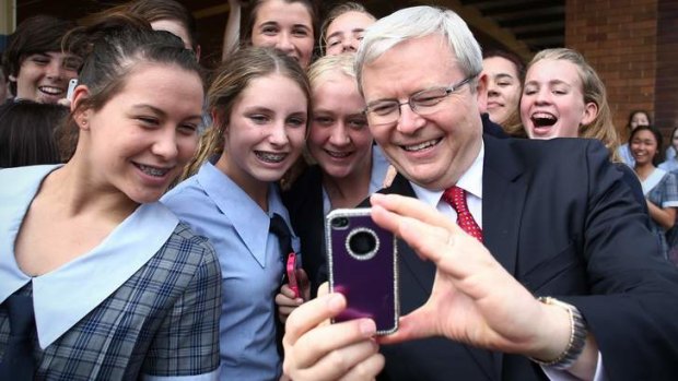 Kevin Rudd poses for selfies at on the campaign trail in Caboolture.