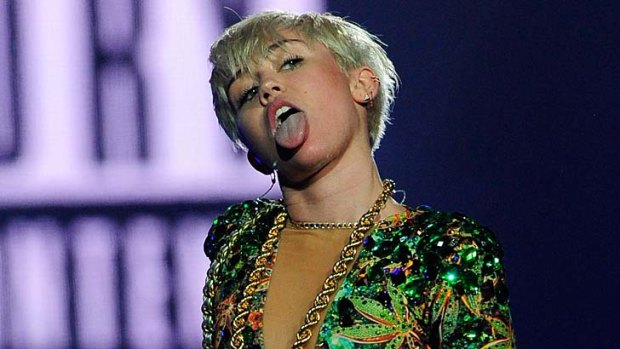 Singer Miley Cyrus performs during her Bangerz tour at the MGM Grand Garden Arena on March 1, 2014 in Las Vegas, Nevada.