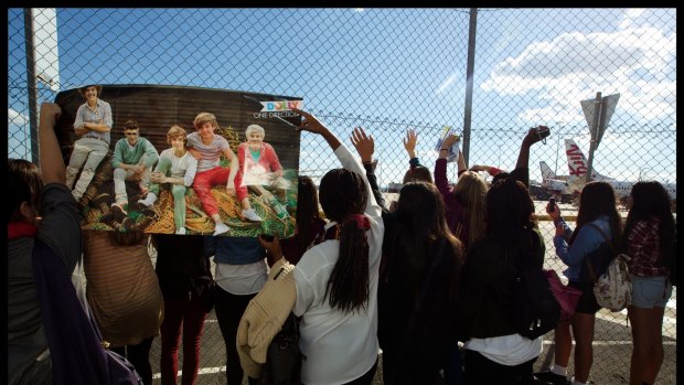 Teenagers waiting for One Direction at Tullamarine Airport. The band is among VIP clients who have used AVMIN for charter flights. 