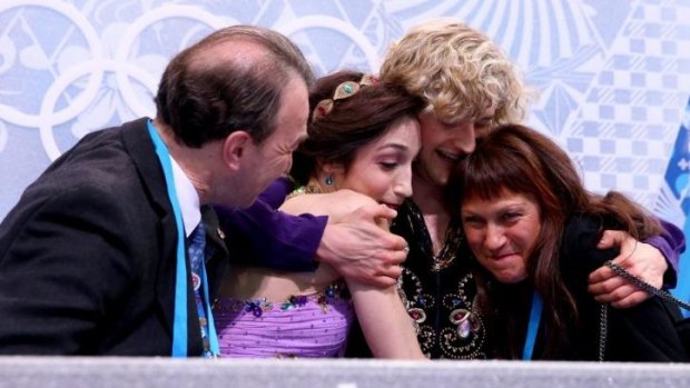 Tight bunch ... Meryl Davis  and Charlie White of the United States celebrate the gold medal with thier coaches Oleg Epstein (left) and Marina Zoueva (right) in the figure skating ice dance free dance.